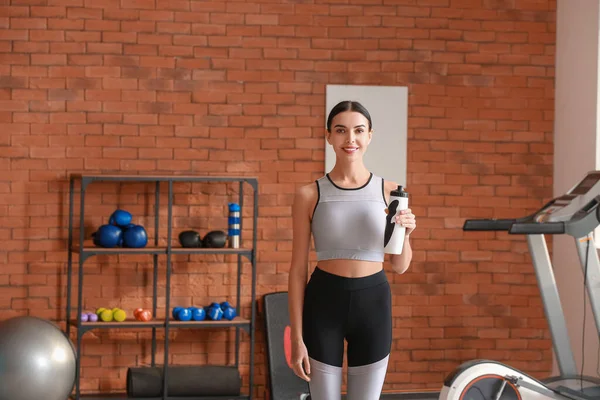 Portrait of female coach in gym