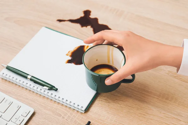 Woman Spilling Cup Coffee Wooden Table Closeup — Stock Photo, Image