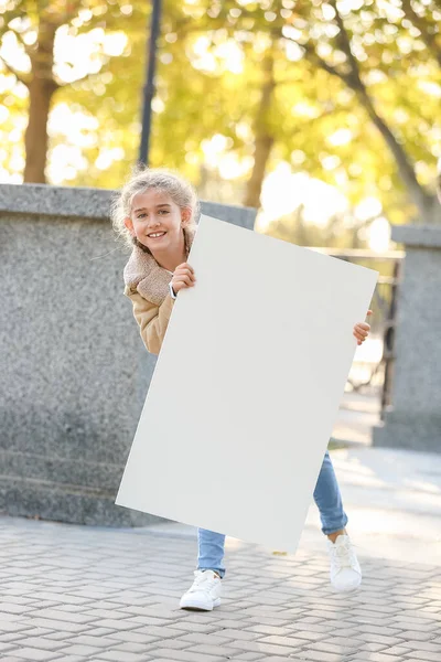 Cute Little Girl Blank Poster Outdoors — Stock Photo, Image