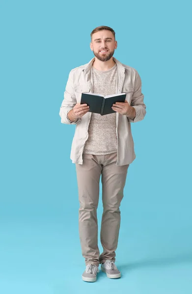 Young Man Reading Book Color Background — Stock Photo, Image