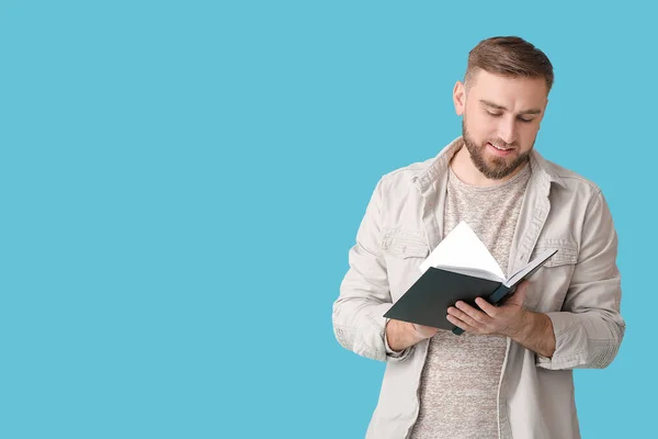 Young Man Reading Book Color Background — Stock Photo, Image