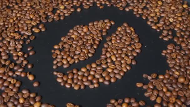 Rotating Dark Board Roasted Coffee Beans — Stock Video