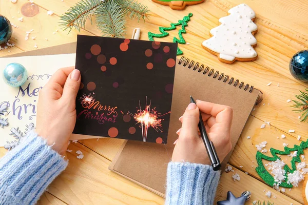 Woman Writing Greeting Postcard Christmas Celebration Table — Stock Photo, Image