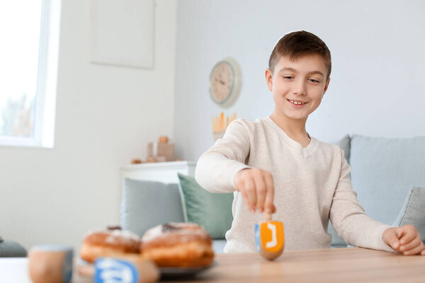 Happy boy celebrating Hannukah at home