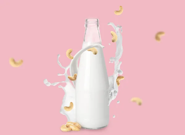 Bottiglia Latte Anacardi Con Spruzzi Sfondo Colore — Foto Stock
