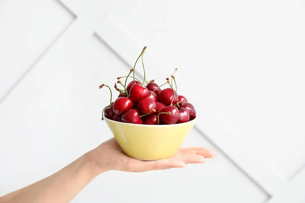 Female Hand Bowl Tasty Cherry Light Background — Stock Photo, Image