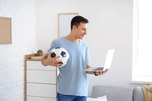 Young man placing sports bet at home