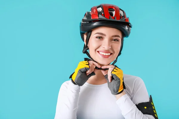 Female Cyclist Putting Helmet Color Background — Stock Photo, Image