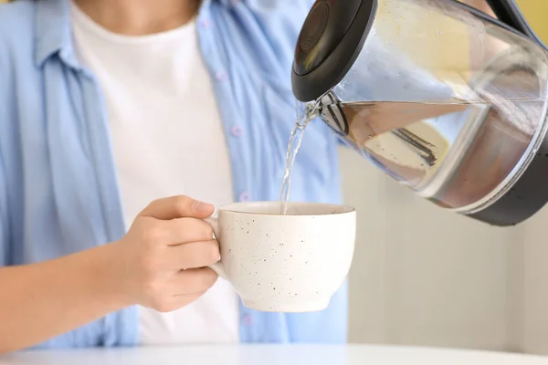 Young Woman Pouring Boiled Water Electric Kettle Cup Kitchen Closeup — Stock Photo, Image