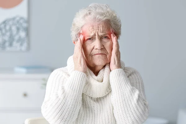 Senior Woman Suffering Headache Home — Stock Photo, Image