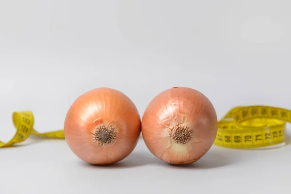 Fresh Onions Measuring Tape Light Background Breast Augmentation Concept — Stock Photo, Image