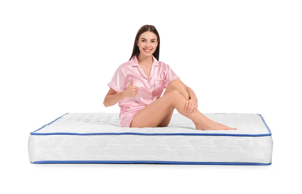 Young Woman Showing Thumb While Sitting Mattress White Background — Stock Photo, Image