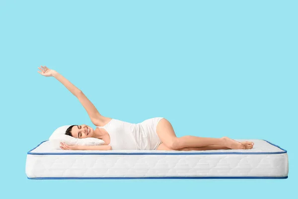 Young Woman Lying Mattress Color Background — Stock Photo, Image