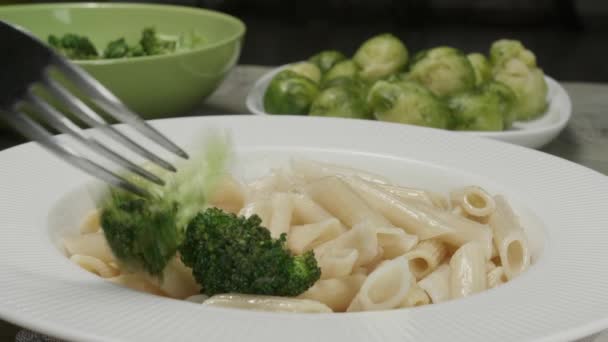 Putting Broccoli Boiled Pasta Plate Closeup — Stock Video