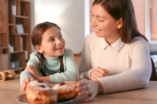 Happy Little Girl Mother Eating Tasty Donuts Hannukah Home — Stock Photo, Image