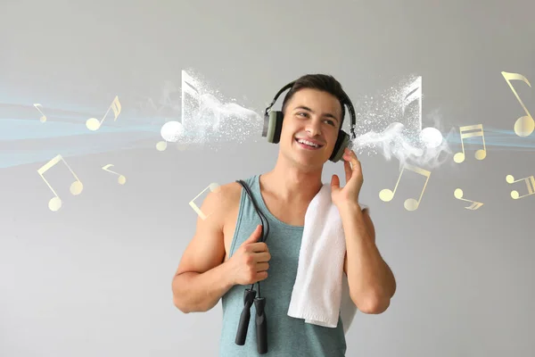 Sporty Young Man Headphones Listening Music Light Background — Stock Photo, Image