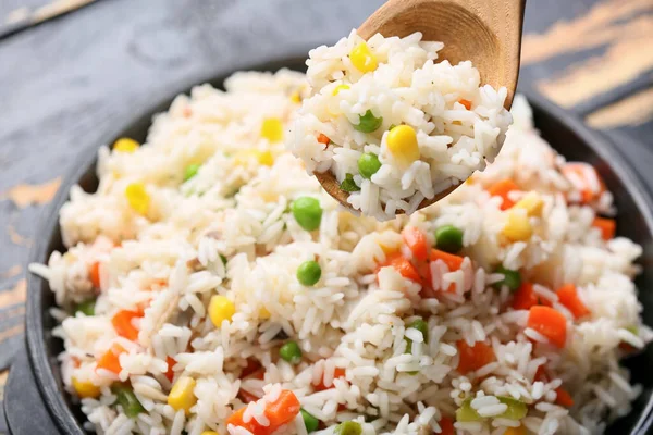 Bowl Tasty Pilaf Wooden Spoon Table — Stock Photo, Image