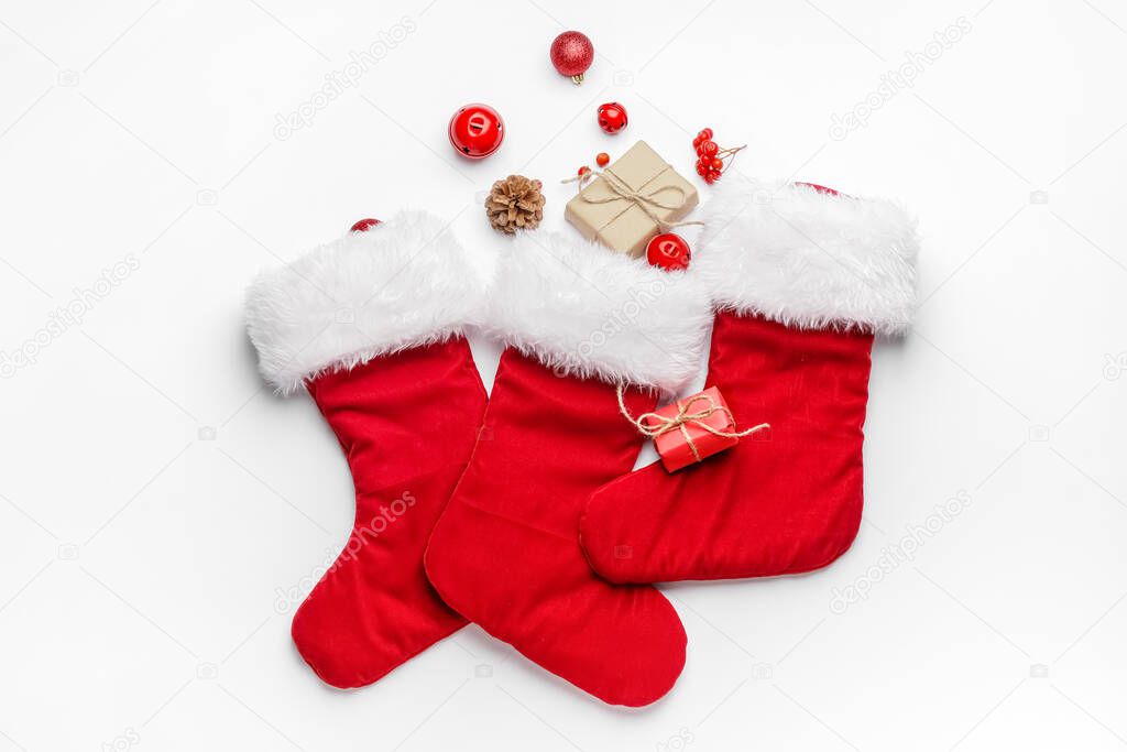 Composition with Christmas socks on white background