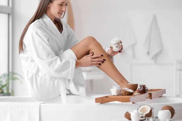 Beautiful Young Woman Applying Coconut Oil Bathroom — Stock Photo, Image