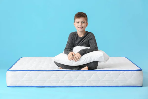 Cute Little Boy Sitting Mattress Color Background — Stock Photo, Image