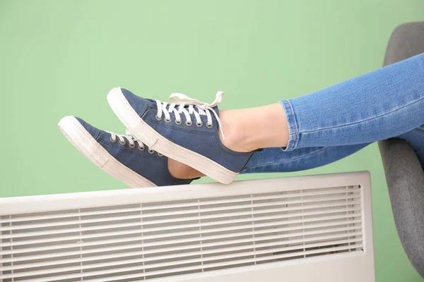 Young Woman Warming Legs Electric Heater Concept Heating Season — Stock Photo, Image