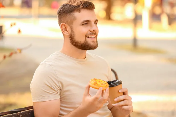 Handsome Young Man Sweet Donut Coffee Park — Stock Photo, Image
