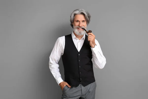 Mature Man Smoking Pipe Grey Background — Stock Photo, Image