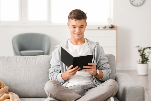 Teenage Boy Reading Book Home — Stock Photo, Image