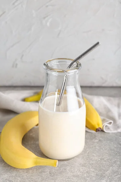 Bottle Tasty Banana Smoothie Grey Background — Stock Photo, Image