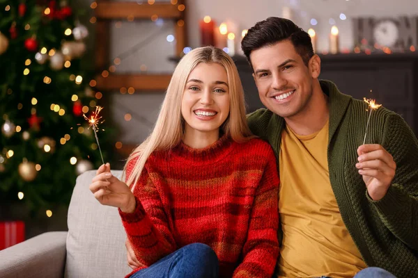 Happy Young Couple Sparklers Celebrating Christmas Home — Stock Photo, Image