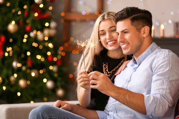 Happy Young Couple Sparklers Celebrating Christmas Home — Stock Photo, Image