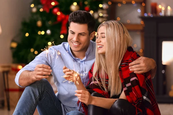 Happy Young Couple Sparklers Celebrating Christmas Home — Stock Photo, Image