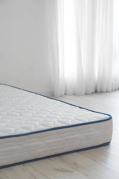 Modern orthopedic mattress in room