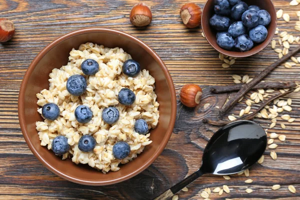 Bowl Tasty Sweet Oatmeal Wooden Table — Stock Photo, Image