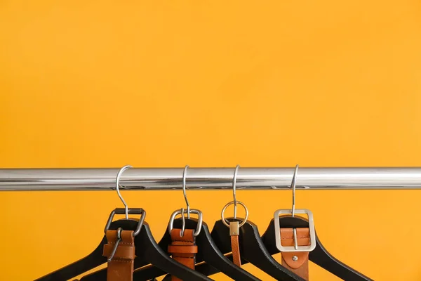 Rack Clothes Hangers Belts Color Background — Stock Photo, Image