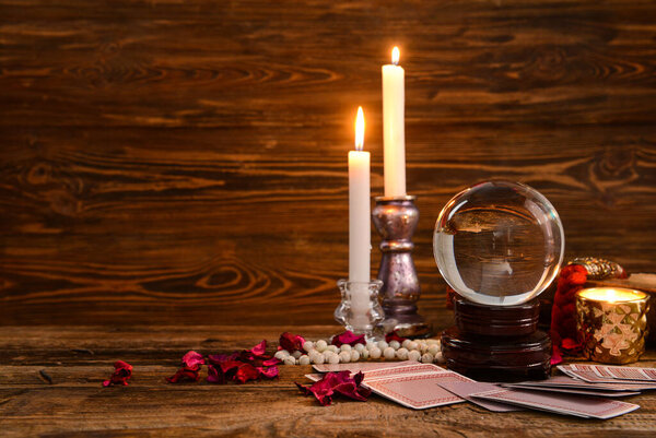 Accessories of fortune teller on table