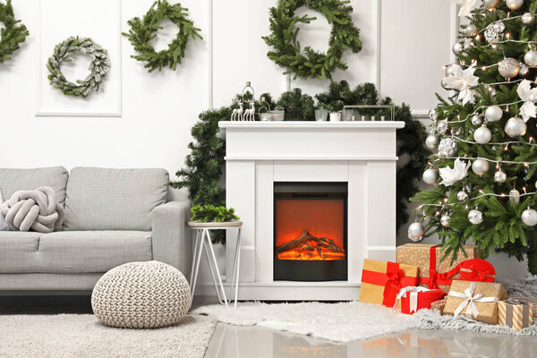 Interior of living room with fireplace decorated for Christmas