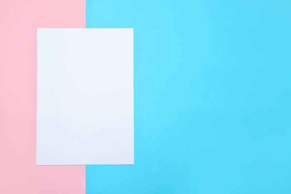 Blank paper sheet on color background