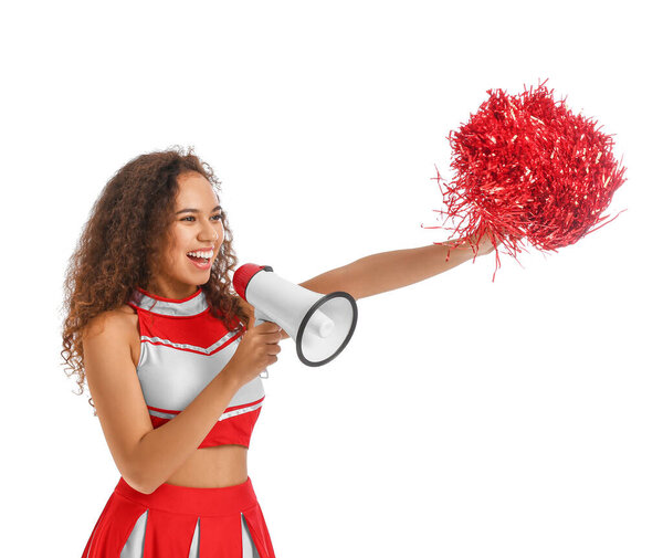 Beautiful young cheerleader with megaphone on white background