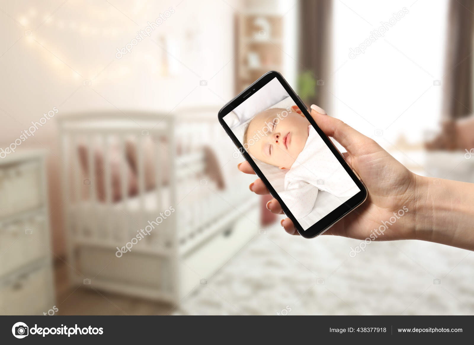 Mother Using Modern Mobile Phone Baby Monitor Home Stock Photo by