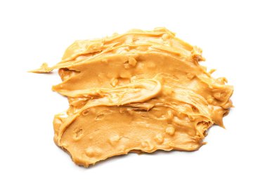 Beyaz arka planda lezzetli fıstık ezmesi.