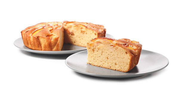Plate with tasty peach pie on white background