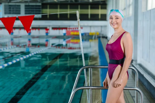 Sporty female swimmer in pool