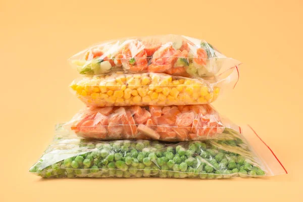 Plastic Bags Frozen Vegetables Color Background — Stock Photo, Image