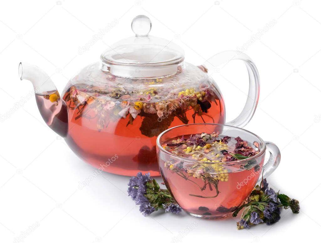 Cup and teapot with floral tea on white background