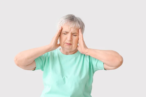 Stressed Senior Woman Suffering Headache Light Background — Stock Photo, Image