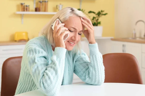 Stressed Mature Woman Talking Mobile Phone Home — Stock Fotó