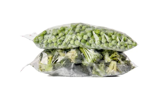 Gefrorener Brokkoli Und Grüne Erbsen Plastiktüten Auf Weißem Hintergrund — Stockfoto