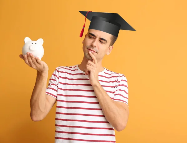 Young Man Graduation Hat Piggy Bank Color Background Concept Savings — Stock Photo, Image