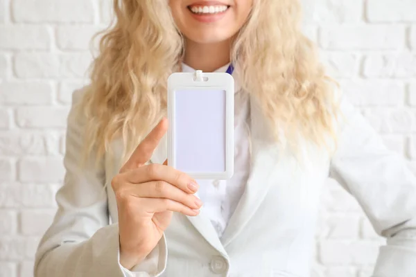 Young Woman Blank Badge Brick Wall — Stock Photo, Image